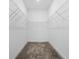 Spacious walk-in closet with ample shelving and neutral carpet at 1757 Brush Cherry Pl, Ocoee, FL 34761