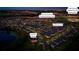 Night community aerial view showcasing lakeside gazebo, future pool and cabanas, school and available homesites at 17847 Adrift Rd, Winter Garden, FL 34787