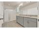 This bathroom offers dual sinks, modern fixtures, granite counters, and a glass enclosed shower at 17847 Adrift Rd, Winter Garden, FL 34787