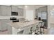 Stylish kitchen featuring an island with seating and stainless steel appliances at 17847 Adrift Rd, Winter Garden, FL 34787