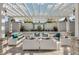 Stylish outdoor lounge area featuring comfortable seating and a decorative pergola for a serene atmosphere at 17847 Adrift Rd, Winter Garden, FL 34787