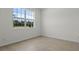 Bright, neutral bedroom with a large window and tile flooring at 2055 Town Pasture Dr, Eustis, FL 32726