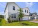 Beautiful two-story home featuring stone accents and a lush green lawn at 2055 Town Pasture Dr, Eustis, FL 32726