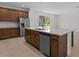 Modern kitchen with stainless steel appliances, a large island, and ample counter space at 2055 Town Pasture Dr, Eustis, FL 32726