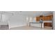 Open-concept living space with tile floors and a staircase at 2055 Town Pasture Dr, Eustis, FL 32726