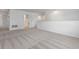 Spacious loft area with neutral carpet, white walls and trim, and stairway at 2055 Town Pasture Dr, Eustis, FL 32726