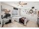 Bright bedroom with a full bed, desk, gallery wall and window with natural light at 206 E South St # 3008, Orlando, FL 32801