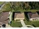 Aerial view showcases a single-Gathering home with mature landscaping and a private driveway at 207 Black Springs Ln, Winter Garden, FL 34787