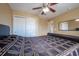 Bedroom with neutral carpet, ceiling fan, bright window, and comfortable bed at 207 Black Springs Ln, Winter Garden, FL 34787