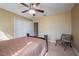 A bright bedroom with carpet and a ceiling fan, perfect for relaxing at 207 Black Springs Ln, Winter Garden, FL 34787