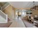 Spacious foyer featuring tile floors, staircase, and open access to dining area at 207 Black Springs Ln, Winter Garden, FL 34787