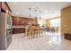 Spacious kitchen features stainless steel appliances, center island, and tile flooring at 207 Black Springs Ln, Winter Garden, FL 34787