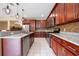 Well-equipped kitchen featuring stainless steel appliances, granite countertops, and custom cabinets at 207 Black Springs Ln, Winter Garden, FL 34787