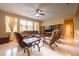 Cozy living room featuring tile floors, lots of light, ceiling fan, and comfortable seating at 207 Black Springs Ln, Winter Garden, FL 34787