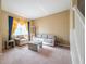 Comfortable living room featuring neutral tones, plush seating, and natural light at 207 Black Springs Ln, Winter Garden, FL 34787