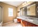 Neutral bathroom with double sinks, granite countertops, and great light at 207 Black Springs Ln, Winter Garden, FL 34787