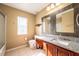 Neutral bathroom with double sinks, granite countertops, and great light at 207 Black Springs Ln, Winter Garden, FL 34787