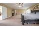 Large primary bedroom has multiple closets and neutral decor at 207 Black Springs Ln, Winter Garden, FL 34787