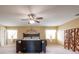 Spacious bedroom features a ceiling fan, natural light, and neutral decor at 207 Black Springs Ln, Winter Garden, FL 34787