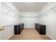 This walk-in closet features wire shelving and built-in drawers at 207 Black Springs Ln, Winter Garden, FL 34787