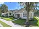 Inviting single-story home with a neatly landscaped front yard at 2112 Cypress Bay Blvd, Kissimmee, FL 34743