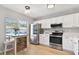 Well-lit kitchen featuring stainless steel appliances and eat-in nook at 2112 Cypress Bay Blvd, Kissimmee, FL 34743
