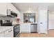 Bright kitchen featuring stainless steel appliances and sleek countertops at 2112 Cypress Bay Blvd, Kissimmee, FL 34743