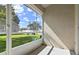 Screened patio with view of the community green space and manicured lawn in a residential neighborhood at 2112 Cypress Bay Blvd, Kissimmee, FL 34743