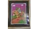 Framed artwork depicting the Orange Bird and Tiki house, displayed on a wall, adding charm at 2348 Silver Palm, Kissimmee, FL 34747