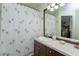 Bathroom featuring a vanity with a large mirror, and palm-tree themed shower curtain at 2348 Silver Palm, Kissimmee, FL 34747