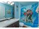 The bathroom showcases a vanity and a 'Moana' themed shower curtain at 2348 Silver Palm, Kissimmee, FL 34747