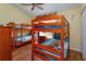 Spacious bedroom with bunk beds and a window offering natural light at 2348 Silver Palm, Kissimmee, FL 34747