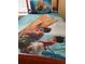 Close up of a bed showing vibrant 'Moana' themed bedding and matching pillow at 2348 Silver Palm, Kissimmee, FL 34747