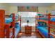 Fun bedroom with four bunk beds and a window with a grass decorative valance at 2348 Silver Palm, Kissimmee, FL 34747