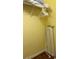 Walk in closet featuring storage rack, shelves and an ironing board at 2348 Silver Palm, Kissimmee, FL 34747