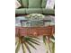 Wicker coffee table with glass top and decorative bowl at 2348 Silver Palm, Kissimmee, FL 34747