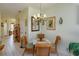 A sunny dining area features a glass-top table and wicker chairs at 2348 Silver Palm, Kissimmee, FL 34747