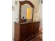 Bedroom dresser with decorative mirror and tropical-themed lamps and artwork at 2348 Silver Palm, Kissimmee, FL 34747