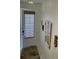 The entryway is decorated with tropical-themed art pieces and a bamboo shade at 2348 Silver Palm, Kissimmee, FL 34747