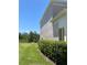 Well-maintained exterior showcasing lush greenery and a neatly manicured lawn at 2348 Silver Palm, Kissimmee, FL 34747