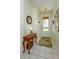 Inviting foyer showcasing tiled floors, decorative table, and a charming rug near the door at 2348 Silver Palm, Kissimmee, FL 34747