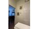 Hallway with vintage Disney travel posters leading to a bedroom with hardwood floors at 2348 Silver Palm, Kissimmee, FL 34747