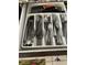 Organized kitchen drawer with cutlery inserts, featuring knives, spoons, forks, and other utensils at 2348 Silver Palm, Kissimmee, FL 34747
