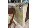 Close-up of kitchen island with bamboo finish, granite countertop, rattan chair, and electrical outlet at 2348 Silver Palm, Kissimmee, FL 34747
