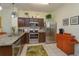 Well-lit kitchen featuring stainless steel appliances and granite countertops at 2348 Silver Palm, Kissimmee, FL 34747