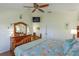 Spacious main bedroom with ceiling fan, television, and ensuite closet with double doors at 2348 Silver Palm, Kissimmee, FL 34747