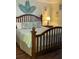Bright bedroom with wooden bed frame, hardwood floors, and soothing tropical accents at 2348 Silver Palm, Kissimmee, FL 34747
