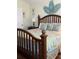 Cozy main bedroom with a decorative wooden bed frame, tropical decor, and a bright, airy feel at 2348 Silver Palm, Kissimmee, FL 34747