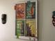 Wall decor featuring four 'Enchanted Tiki Room' posters in a vintage window frame and a tiki mask at 2348 Silver Palm, Kissimmee, FL 34747