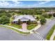 Aerial view of the community clubhouse, showcasing the beautiful landscaping and convenient parking areas at 2411 Sabastian St, Mount Dora, FL 32757
